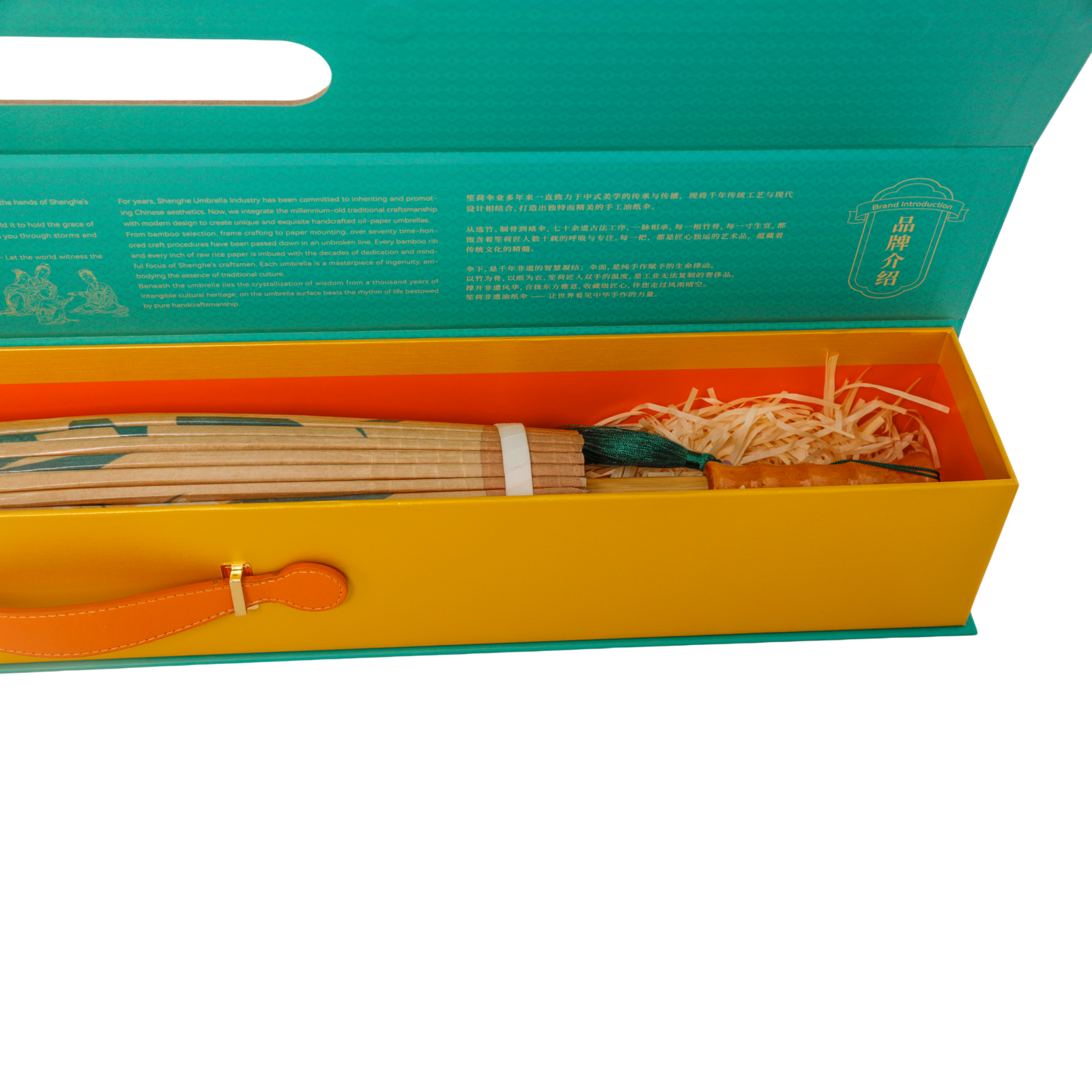 Umbrella handle and folded canopy inside the golden gift-box interior